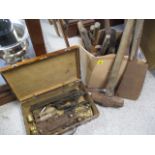 A selection of vintage tools to include a sledge hammer, hammers, door accessories and other items