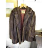 Dickins & Jones - a vintage musquash fur jacket with two large buttons to the front, together with a