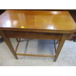 A Victorian mahogany tea table with a foldover top, raised on square, tapered legs, 29 h, 36 w