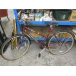 A burgundy Raleigh Pioneer Trail 18 Dual SIS bicycle