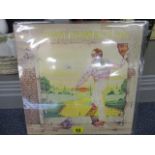 An Elton John Yellow Brick Road LP record, triple Gatefold, pressed on yellow vinyl