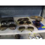 Six pairs of sun glasses to include Yves Saint Laurent, Fendi, Jaeger, Gucci, Ted Lapidus and