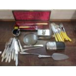 Silver and silver plate to include a horn handled magnifying glass, a hip flask, fish knives and