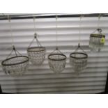 A group of five gilt metal and cut, faceted glass bag lights