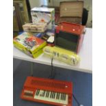 A mixed lot to include a portable television, a desk calendar, a miniature sewing machine, boxed