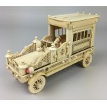 An unusual early 20th Century Indian carved ivory Model of an Automobile,With uniformed chauffeur,