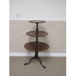 A 19th Century mahogany three tier circular graduated Dumb Waiter on spiral turned column and tripod