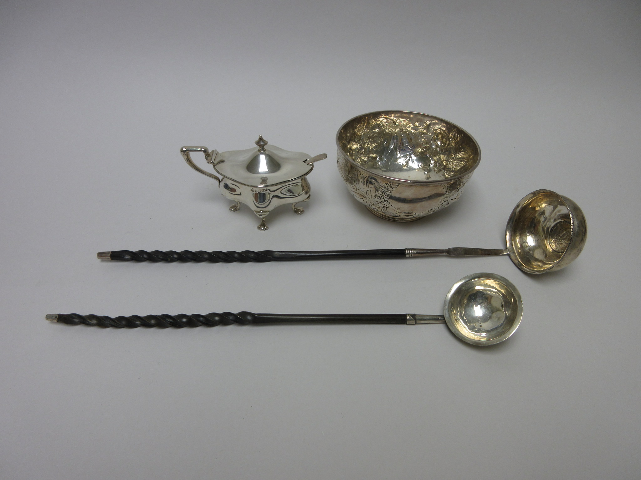 A Victorian silver circular Sugar Bowl with floral and swag embossing, vacant cartouche, London