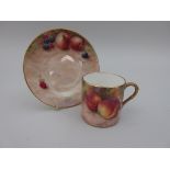 An ORB Coffee Can and Saucer, painted fruit, signed Frank T Higgins