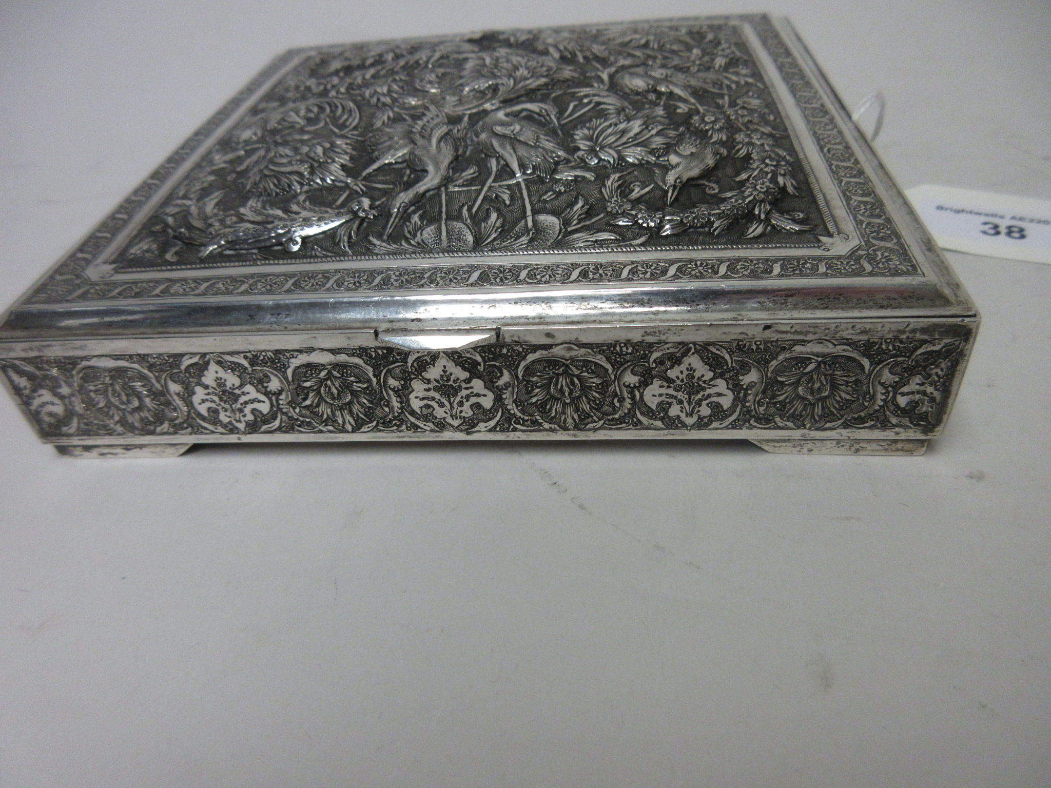 A Persian silver square Box with hinged cover finely embossed and chased with exotic birds amongst - Image 4 of 6