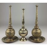 A pair of 20th Century brass rose water Sprinklers and Stands, and another spun brass sprinkler,