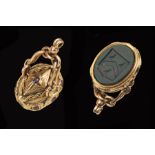 A 9ct gold Swivel Fob Seal set intaglio bloodstone carved crest with foil backed stones to mount