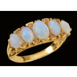 An Opal five stone Ring set graduated oval cabochons with small eight-cut diamonds between,