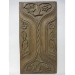 An early carved oak double-sided Panel with fruiting vine and flowers to one side, linenfold on