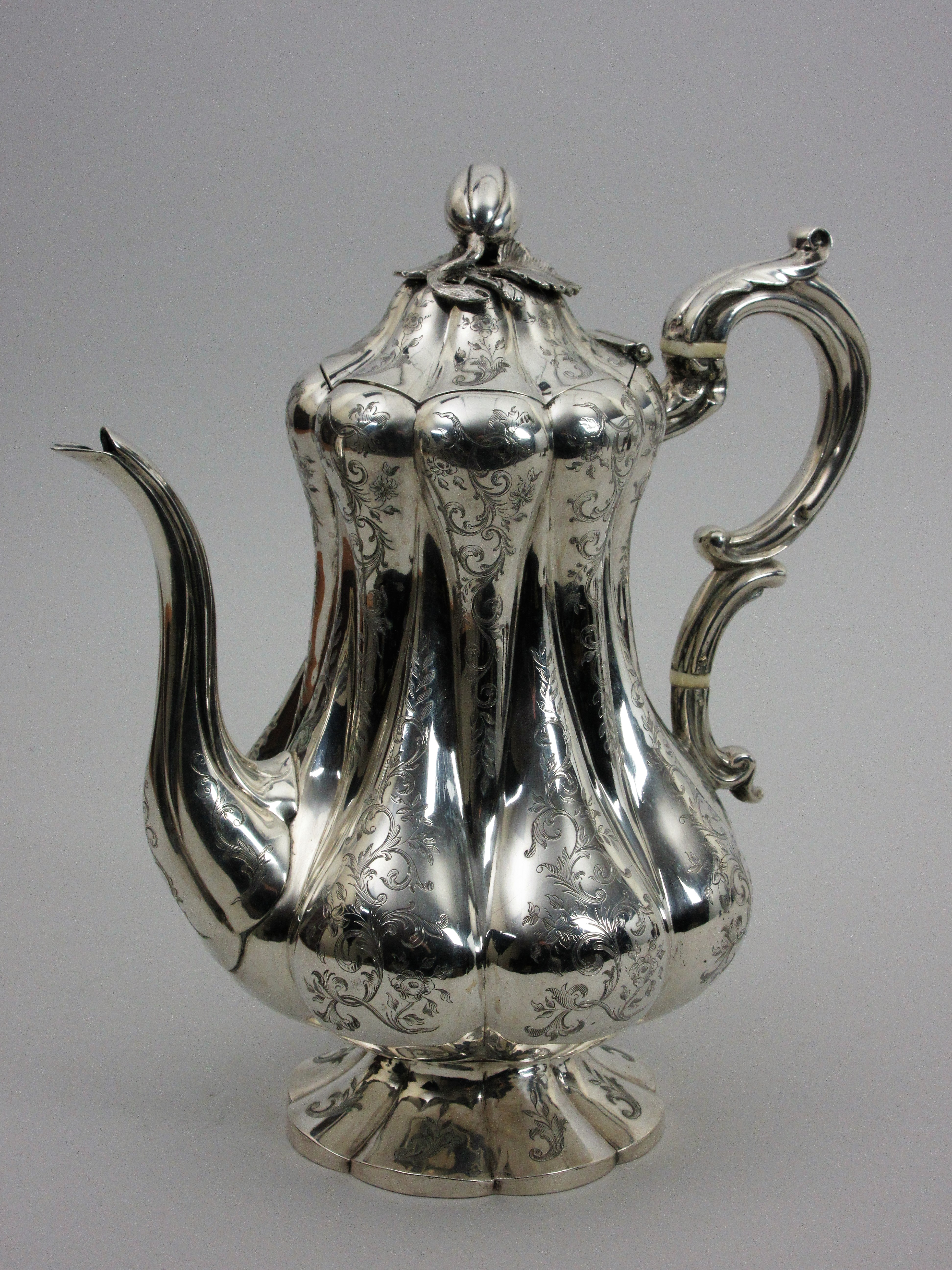 A Victorian silver Coffee Pot of pear shape with leafage scroll engraving, melon finial, London - Image 2 of 7