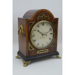 A 19th Century mahogany Bracket Clock with brass inlay and mounts, the circular dial inscribed G.