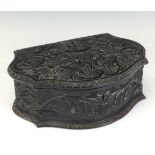 A 19th Century Sinhalese carved ebony serpentine Table Box, With hinged lid, deeply carved all