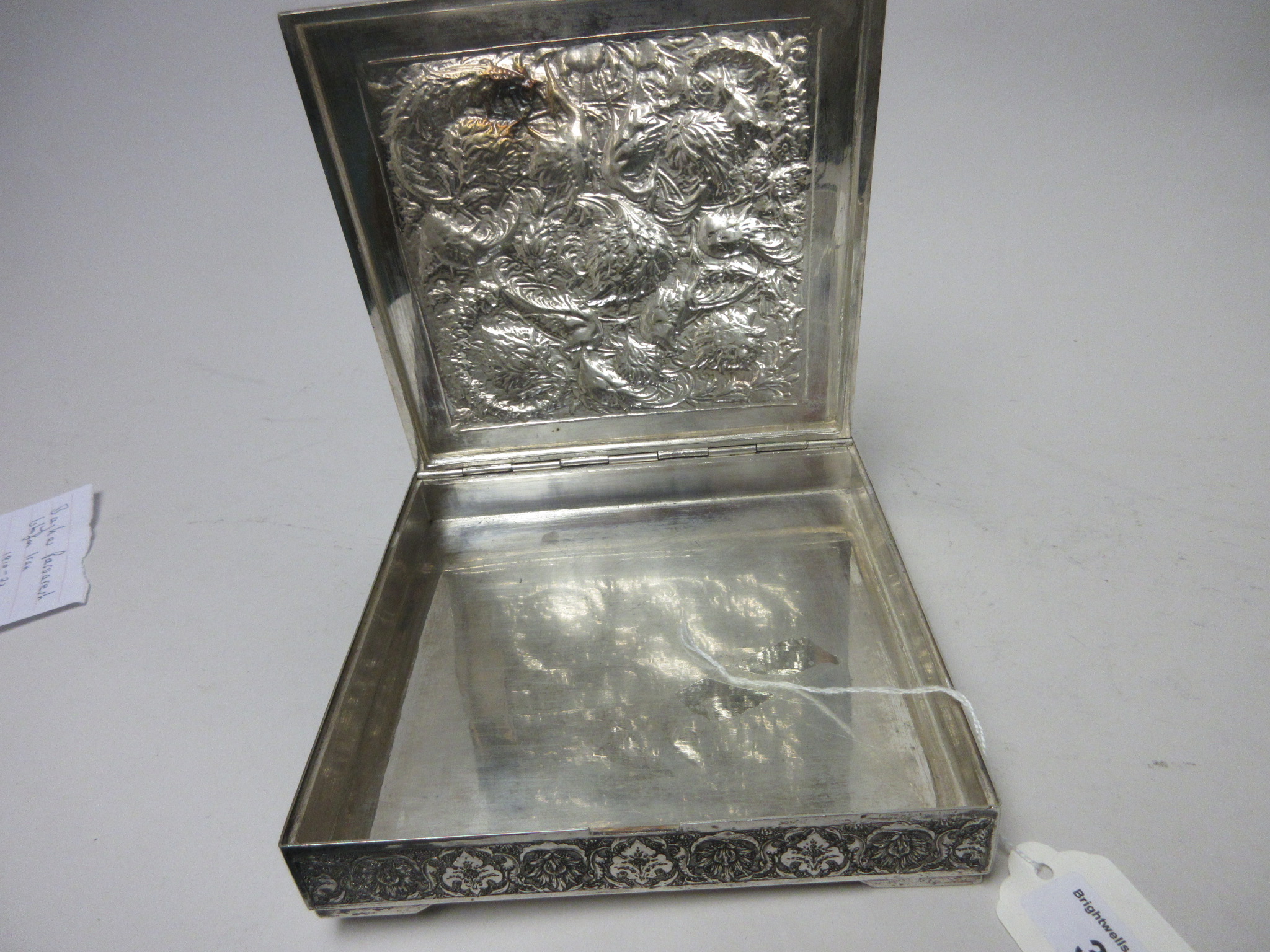 A Persian silver square Box with hinged cover finely embossed and chased with exotic birds amongst - Image 6 of 6