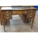A Victorian rosewood and inlaid bow fronted Writing Desk with inset writing surface, the central