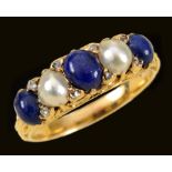 A Lapis Lazuli and half Pearl Ring claw-set three graduated lapis cabochons interspersed with two