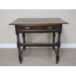 A late 17th Century oak Side Table fitted frieze drawer on bobbin turned and square supports and