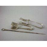 A George III silver Meat Skewer, London 1807, maker: T.H. and two pairs of Asparagus Servers,