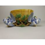 A Minton Majolica circular Fruit Bowl with blue glazed interior, moulded basket work exterior with