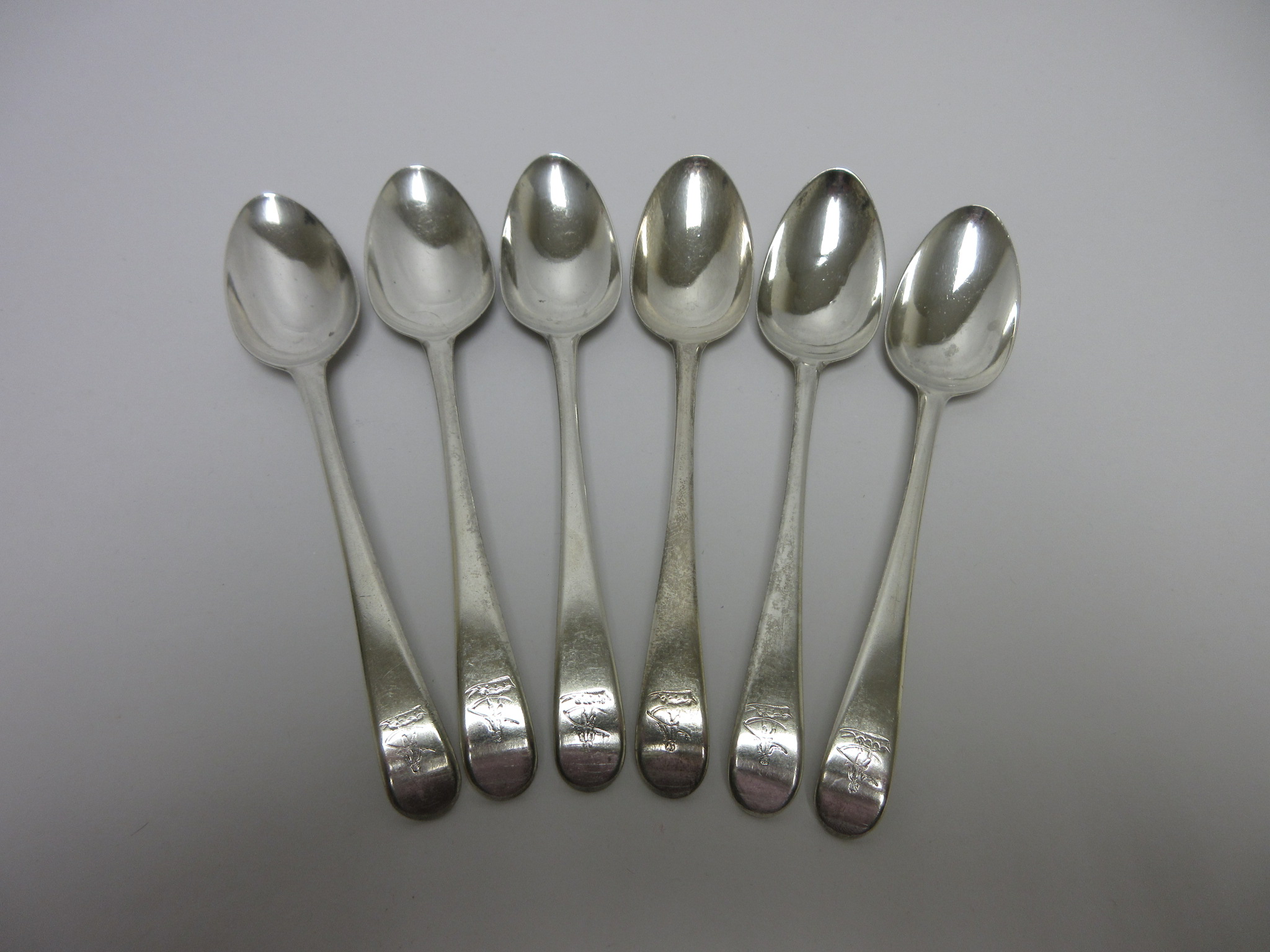 Six George III silver Dessert Spoons old english pattern engraved crests, London 1787, maker: Hester