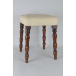 A 19th Century upholstered yew wood Stool on turned supports