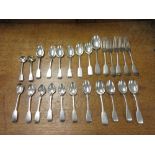A quantity of silver fiddle pattern Cutlery engraved crests, various dates, viz: twelve Teaspoons,