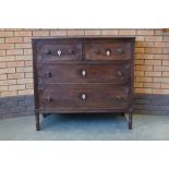 An early 19th Century Colonial rosewood Chest of two short and two long drawers having fan carved