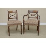 A Set of eight Regency mahogany Dinning Chairs with x frame splats, stuff over seats on turned