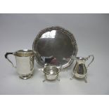 A George V silver circular Waiter with gadroon rim and scroll feet, engraved names to reverse,