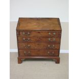 A George III mahogany Bureau with well, fitted interior having central small mirror door flanked