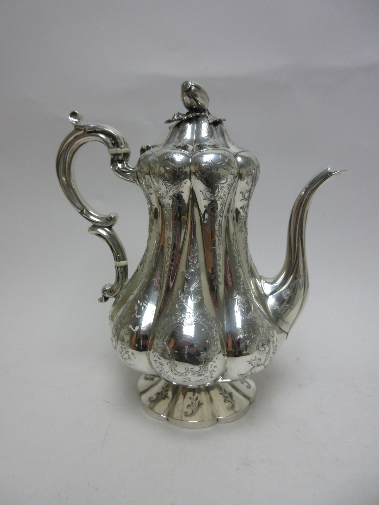 A Victorian silver Coffee Pot of pear shape with leafage scroll engraving, melon finial, London - Image 5 of 7