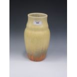 A tall Ruskin pottery Vase with shaped collar, yellow glazed into orange drip glaze to lower