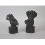 A pair of hollow cast bronze Figures of fantail pigeons on stone bases, 5 1/2 in and 5in H