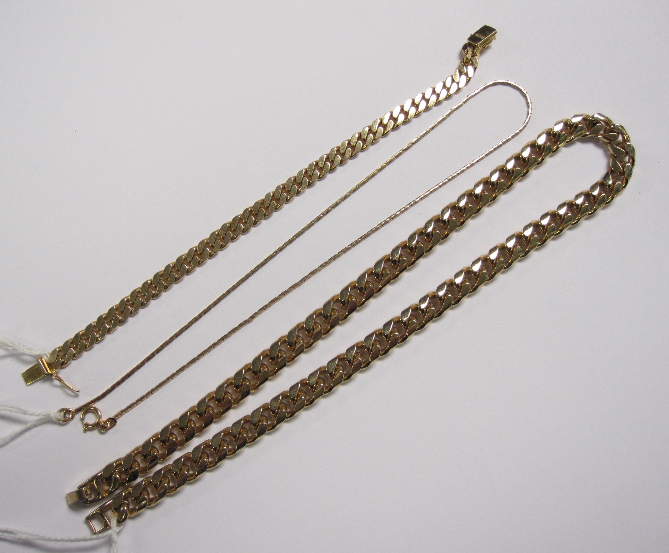 A flattened curb-link Bracelet stamped 585, approx 20gms, a 9ct gold flexible-link Necklet, approx 4