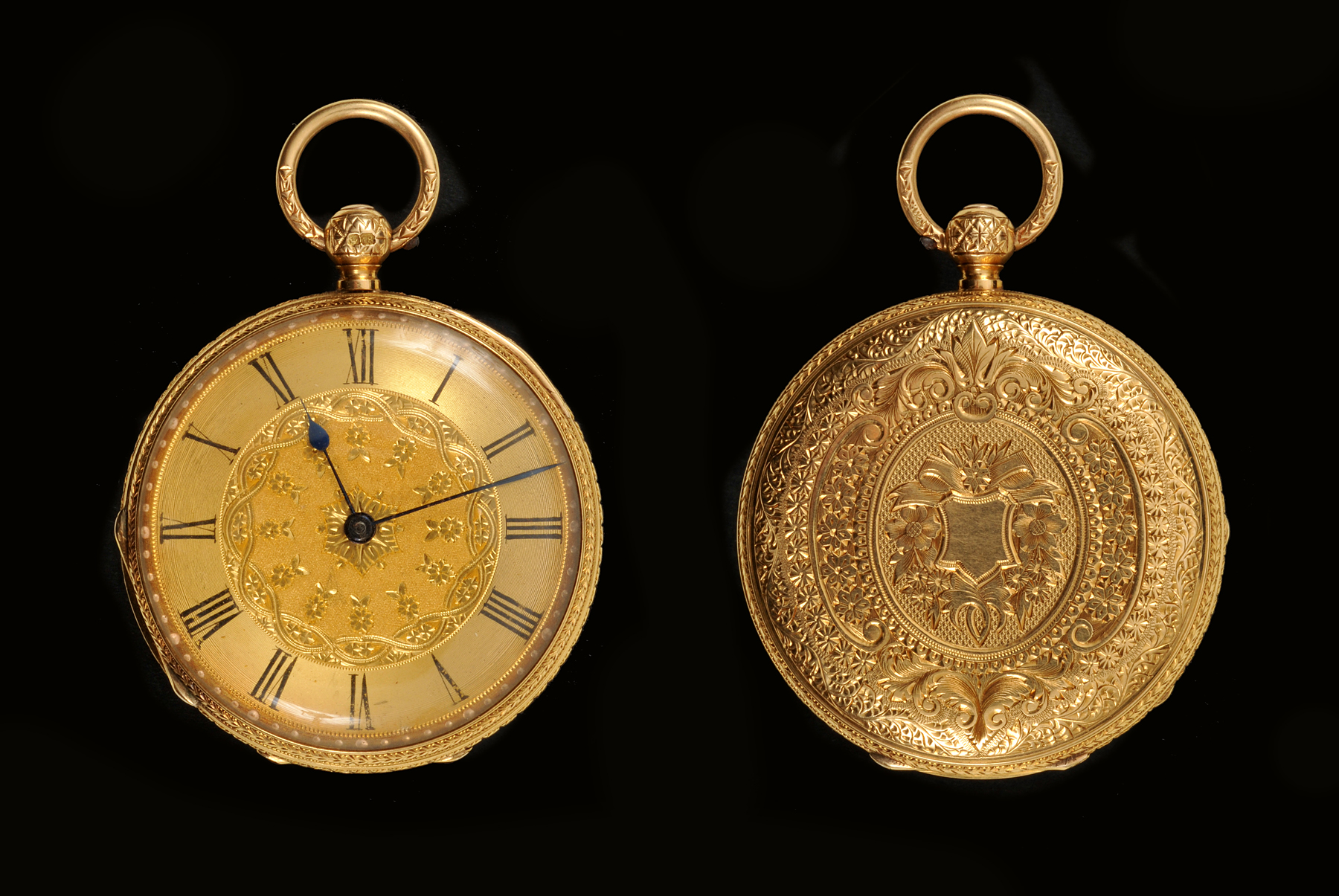 An 18ct gold cased open faced Pocket Watch, the dial and case with floral engraving and vacant