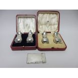 Two pairs of silver Pepperettes, Chester 1918 and Birmingham 1916, both cased, and a George V silver