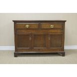 An antique oak small Dresser Base/Side Cabinet fitted two drawers with two panelled doors flanking