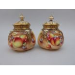 A pair of small Royal Worcester Pot Pourri Jars and Covers of lobed form, moulded top painted