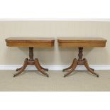 A pair of Regency mahogany Card Tables with rectangular fold-over tops having chamfered corners
