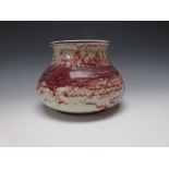 A Ruskin Pottery squat baluster Bowl with mottled red and cream decoration, impressed mark and dated