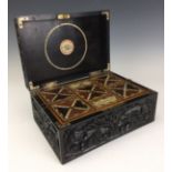 A 19th Century Sinhalese carved ebony rectangular Work Box, deeply carved all over with stylized