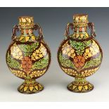 A pair of early 20th Century Bombay School of Art pottery Moon Flasks, George Wilkins Terry /