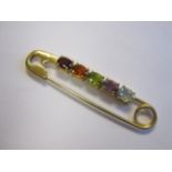 A gem-set Safety Pin Brooch claw-set oval-cut aquamarine, amethyst, peridot, citrine and garnet,