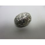 An 18th Century silver Nutmeg Grater of egg shape with floral embossing and chasing, makers mark