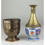 An Indian bronze pedestal Mortar and a Qajar brass mounted Chinese porcelain Bottle,Moradabad and