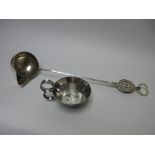 A modern silver designer Soup Ladle with spout and strainer having double mask finial and ring